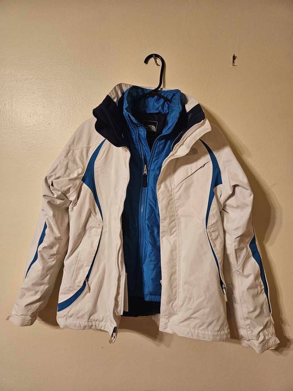 The North Face Men’s White Jacket with Blue Accents